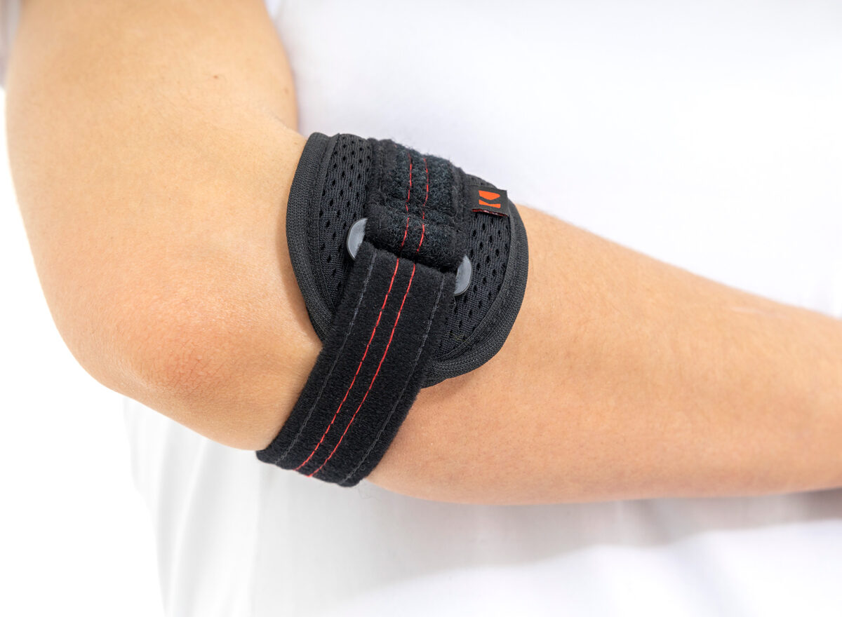 Teniški - golf opornica za komolec s silikonskim delom za masažo